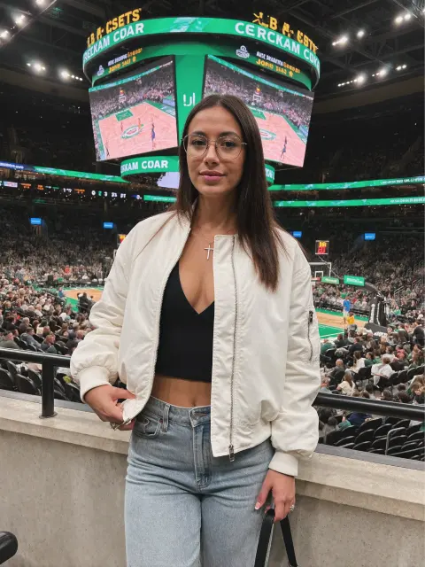 AI photo of a woman with long straight dark brown hair: courtside at a basketball game, made with KREA 2