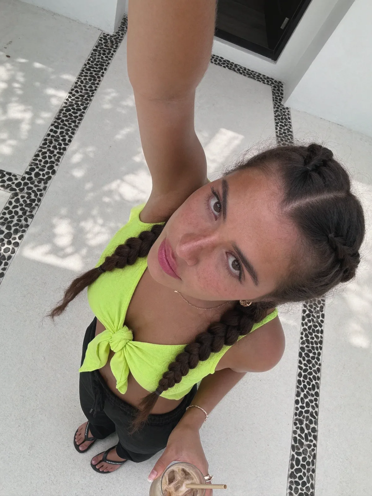 AI photo of a woman with dark brown hair: neon crop top shot from above, made with KREA 2