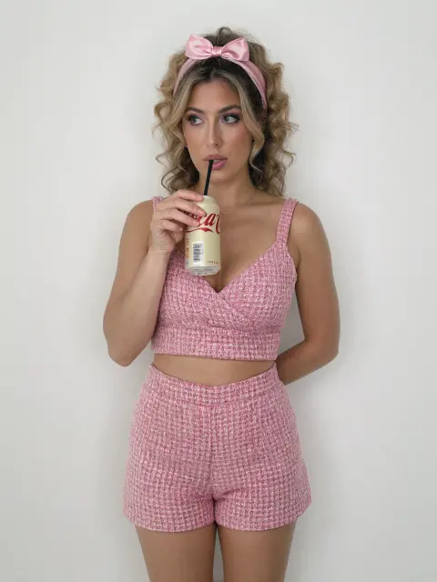 AI photo: pink tweed set sipping a soda, made with KREA 2