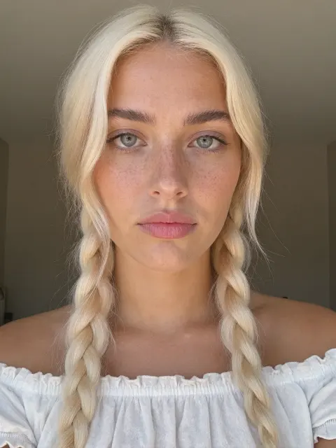 AI photo of a woman with platinum-blonde hair: platinum braids and off-shoulder blouse portrait, made with KREA 2