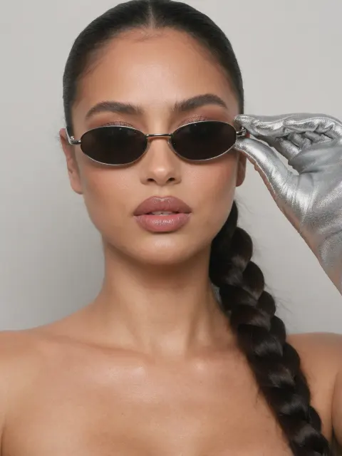 AI photo of a woman with dark brown hair: sleek braid and oval sunglasses beauty portrait, made with KREA 2