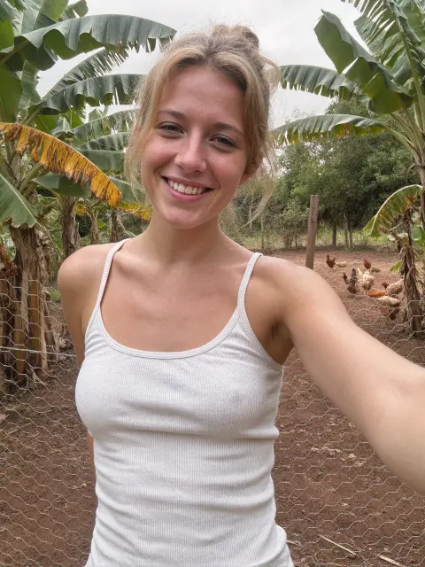 AI photo of a woman with light blonde hair: white tank farm selfie, made with KREA 2